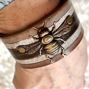 One of a kind! handmade leather wristlet with intricate bee design. Beautiful!